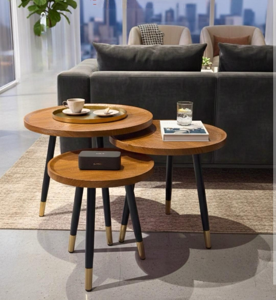 3 Piece hexagonal nesting table set with water-resistant MDF tops, black metal legs, and gold-accented feet for modern home décor