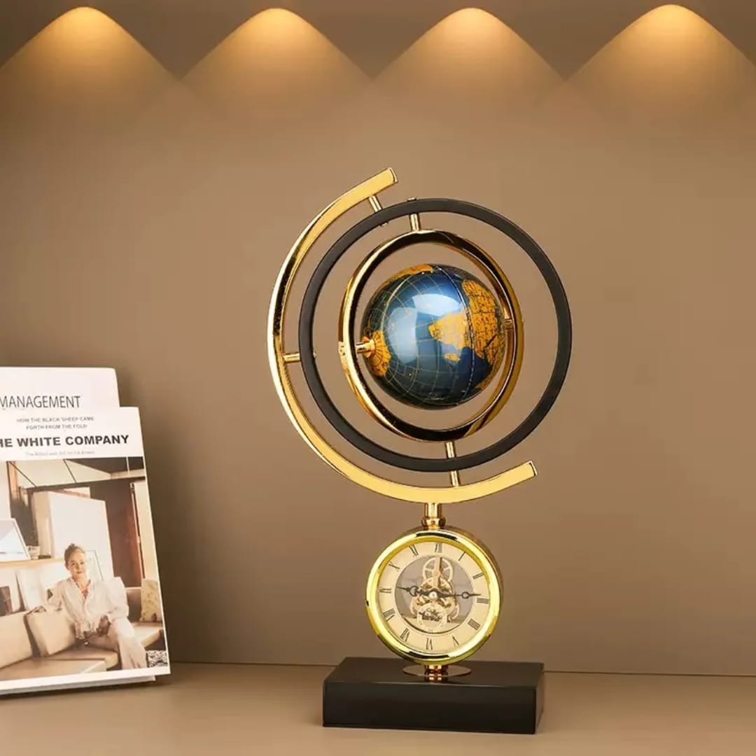 Gold globe with built-in clock on a marble base for elegant home or office décor