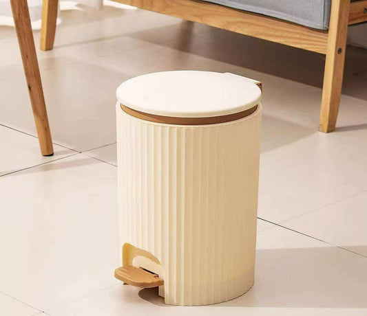 Hard plastic foot pedal dustbin in grey or beige colour