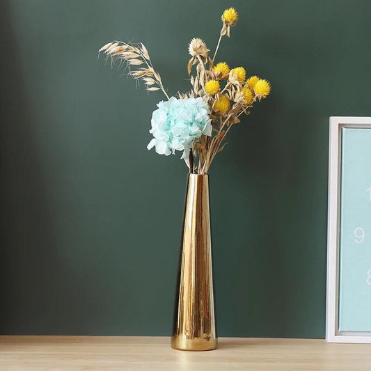 Plain gold ceramic vase with a small narrow neck used for decorative floral arrangements in modern home décor ✨