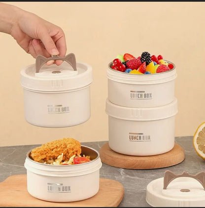Round 550ml stainless steel bento lunch box with lid, microwave safe and portable.