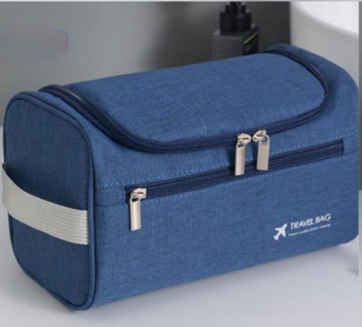 Portable cosmetic travel bag with large capacity for organizing makeup and toiletries in grey and blue colors
