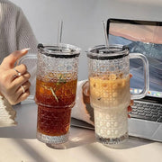 Two piece ribbed borosilicate glass tumbler set with diamond embossed pattern, handles, lids, and reusable straws, 750 ml each.