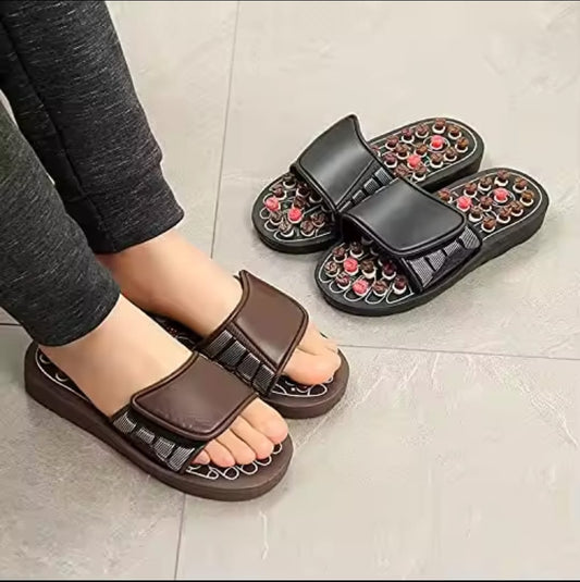 Acupuncture massage sandals with reflexology footbed for foot relaxation and comfort.
