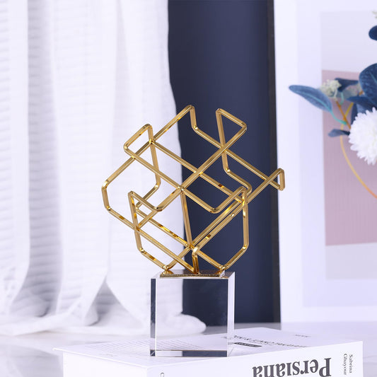 Gold geometric knot statue with crystal base, modern decorative sculpture for home and office décor.
