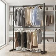 Clothing rack with clothes in a room with shelves and a window.