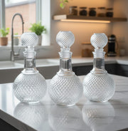 Clear diamond quilted round glass decanter for whisky and scotch, 1 litre capacity