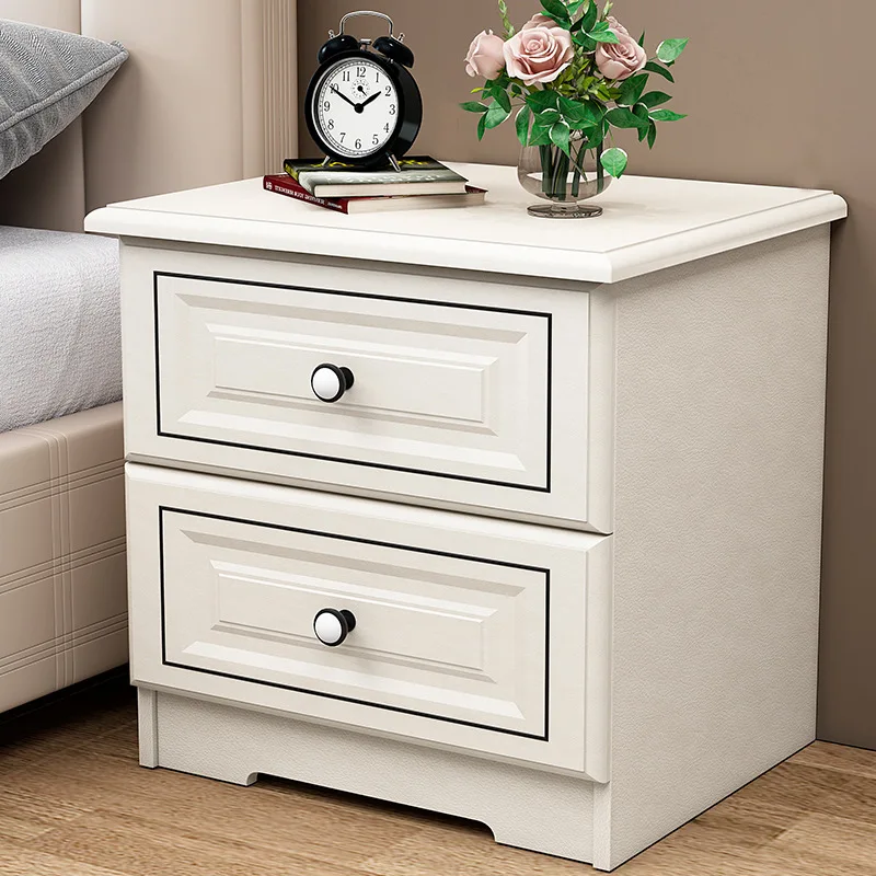 drawer wooden bedside table with whitewashed wood grain finish and black knobs for bedroom storage.