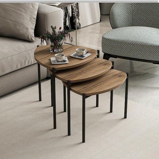 Three-piece triangular nesting coffee table set with varying heights for space-saving use