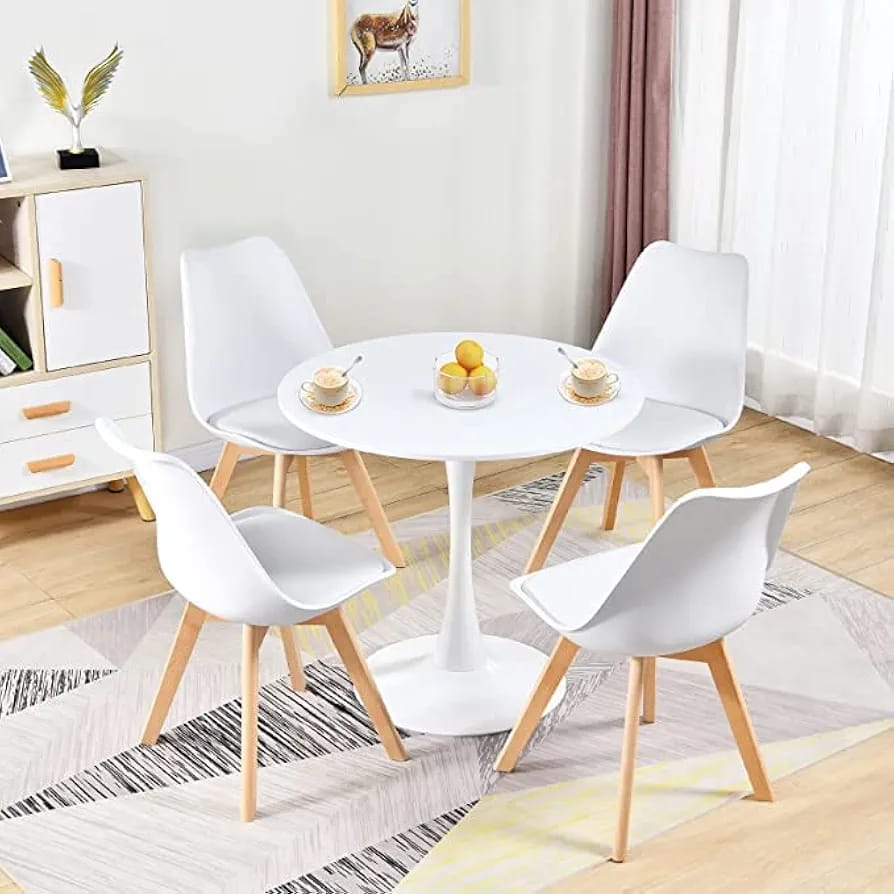 Round wooden table with metallic base and white Eames chair