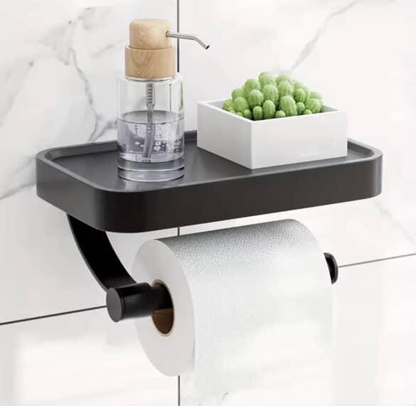 Wall-mounted stainless steel toilet paper holder with phone shelf.