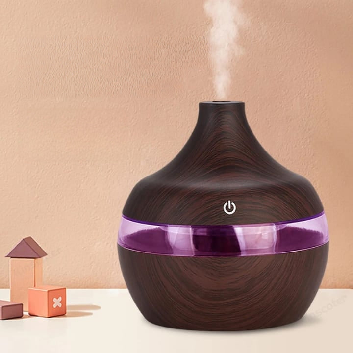 Compact 300ml air humidifier in white for home or office use.