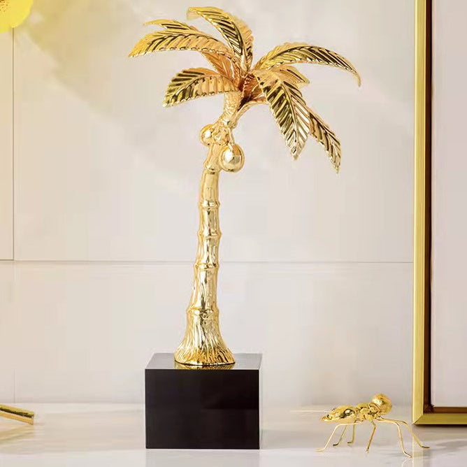 Gold palm tree decor with marble base, elegant tabletop sculpture for modern home styling. 