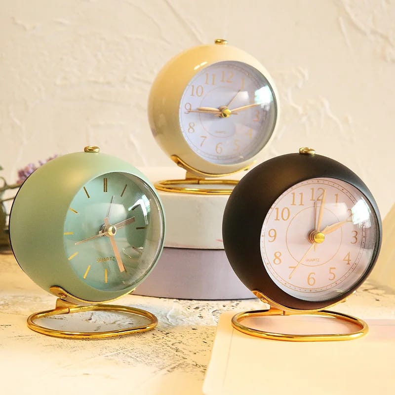 Retro vintage silent alarm clock with night light for bedroom or office use.
