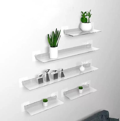 Clear acrylic floating shelf, modern wall-mounted storage for books, décor, or toiletries in small spaces. 