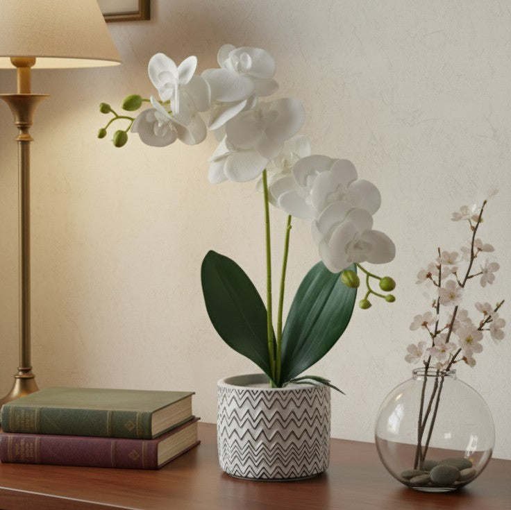 Ceramic vase with a realistic orchid arrangement for home or office decor