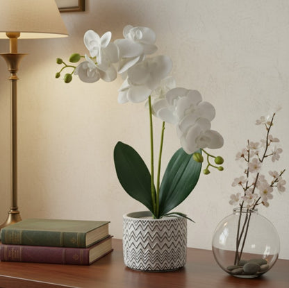 Ceramic vase with a realistic orchid arrangement for home or office decor