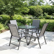 4 piece outdoor patio dining set with round glass table and black folding mesh armchairs for balcony, garden, patio, and outdoor dining spaces.