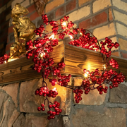 1.8M red berry Christmas garland with warm LED lights for holiday decoration