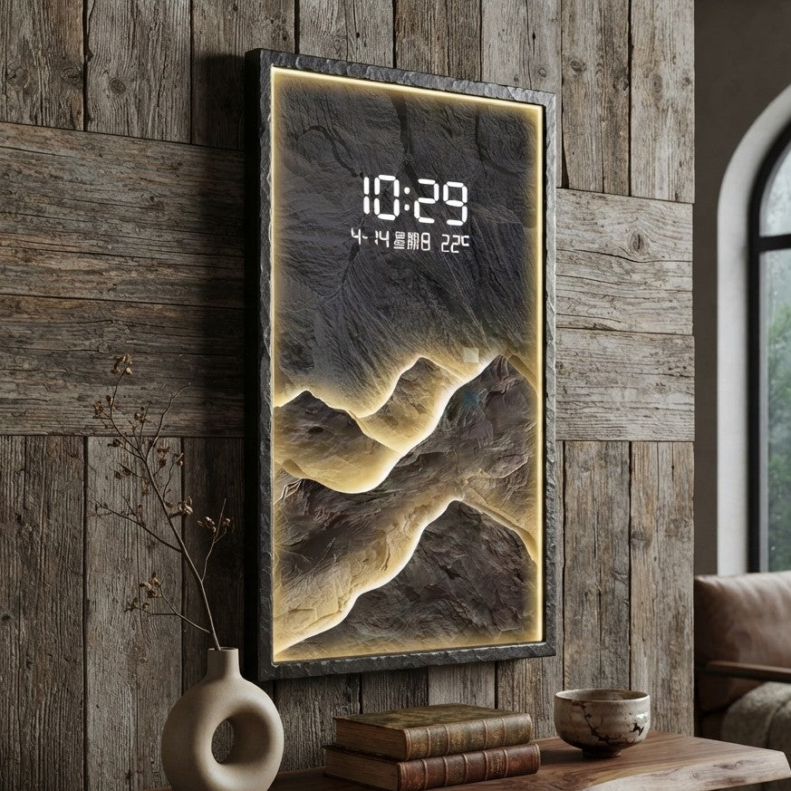 LED decorative wall clock with a layered mountain landscape design, warm ambient backlighting, and digital display showing time, date, day, and temperature.