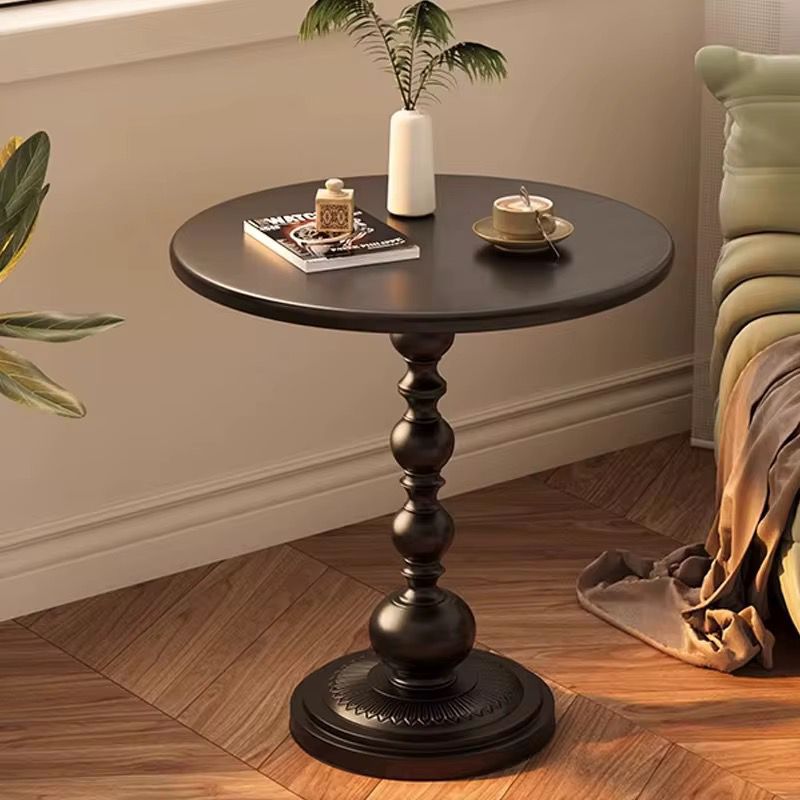 Retro iron pedestal side table with matte black finish, 40cm round top and stable base for modern home décor. 