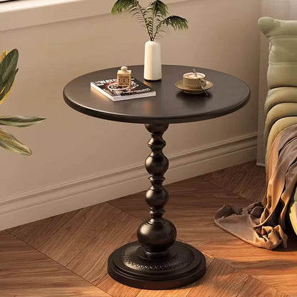 Retro iron pedestal side table with matte black finish, 40cm round top and stable base for modern home décor. 
