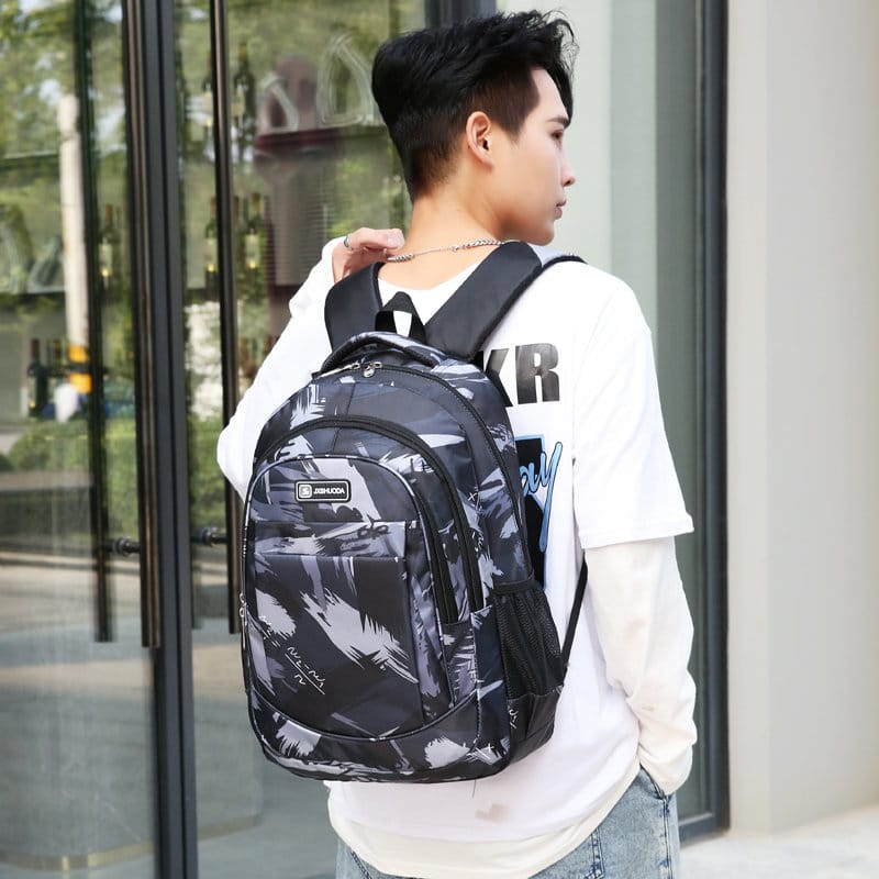 Geometric pattern school bag with multiple compartments and adjustable straps