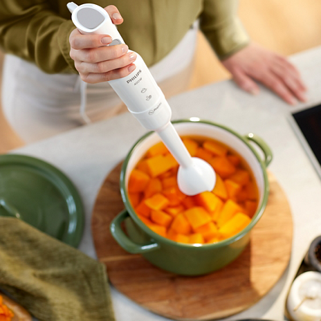 Philips 3000 Series HR2520 ProMix hand blender with stainless steel blending blade and ergonomic white handle.